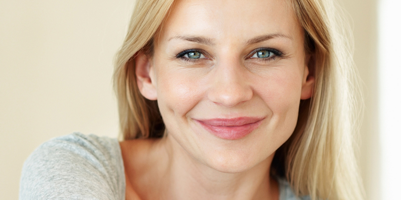 Picture of woman smiling after receiving filler injection